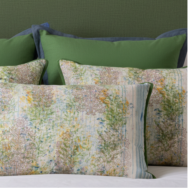 Luxury bed with three Wild Meadow cushions and moss euros