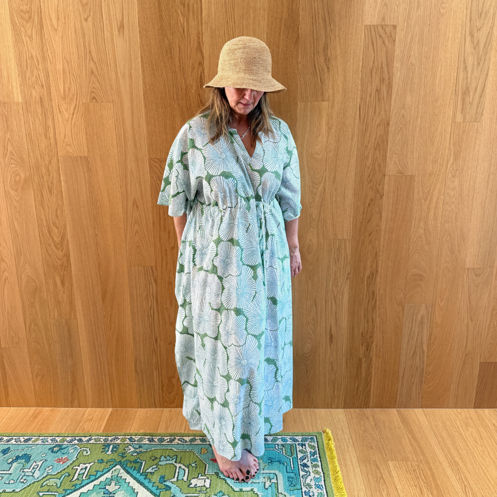 Palm leaf kaftan styled with green and blue rug
